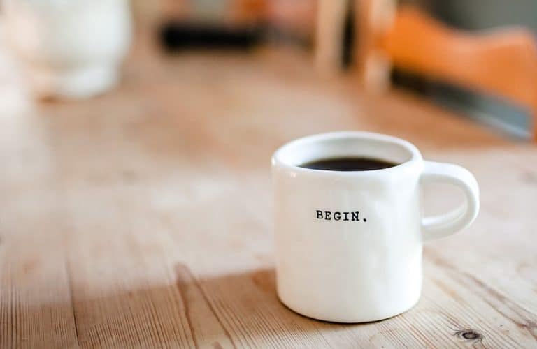 Picture of coffee cup that says begin